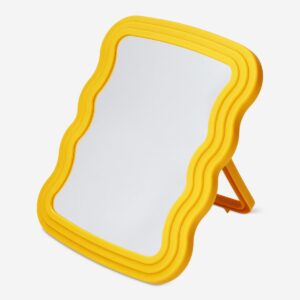 Orange standing mirror with wavy edge design - Image 1